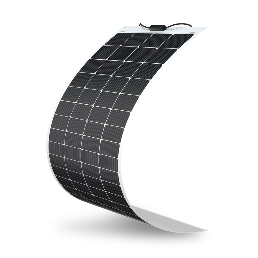 Renogy 200W flexible monocrystalline solar panel photographed curved to show its bendability, with a white ETFE laminate border framing a grid of half-cut monocrystalline cells and a black junction box with two output leads at the top edge.