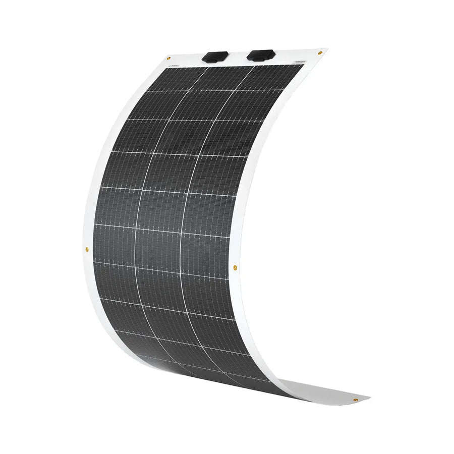 Renogy 100W flexible monocrystalline solar panel photographed curved to show its bendability, with an ETFE laminate surface exposing a 4-by-9 grid of monocrystalline cells, two black MC4 junction boxes at the top edge, and brass grommets at each corner for tie-down mounting.